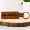 Custom engraved wooden keychain with personalized logo engraving in Vancouver BC