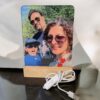 Personalized photo lamp with a family photo on the panel, wooden base and USB cable with a switch