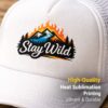 This close-up image highlights the fabric texture and print quality of a personalized sublimation hat. The Stay Wild design is printed using high-quality heat sublimation, ensuring vibrant colors and long-lasting durability. Ideal for custom logos, photos, or text, this white trucker cap is a perfect personalized gift in Vancouver.