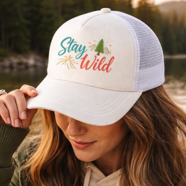 Lifestyle image of personalized white trucker hat with colorful sublimation print design, custom hat worn outdoors in Vancouver
